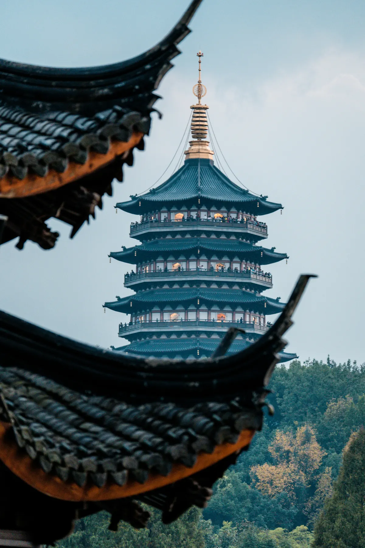 Pagoda rising beyond traditional rooflines in Hangzhou
