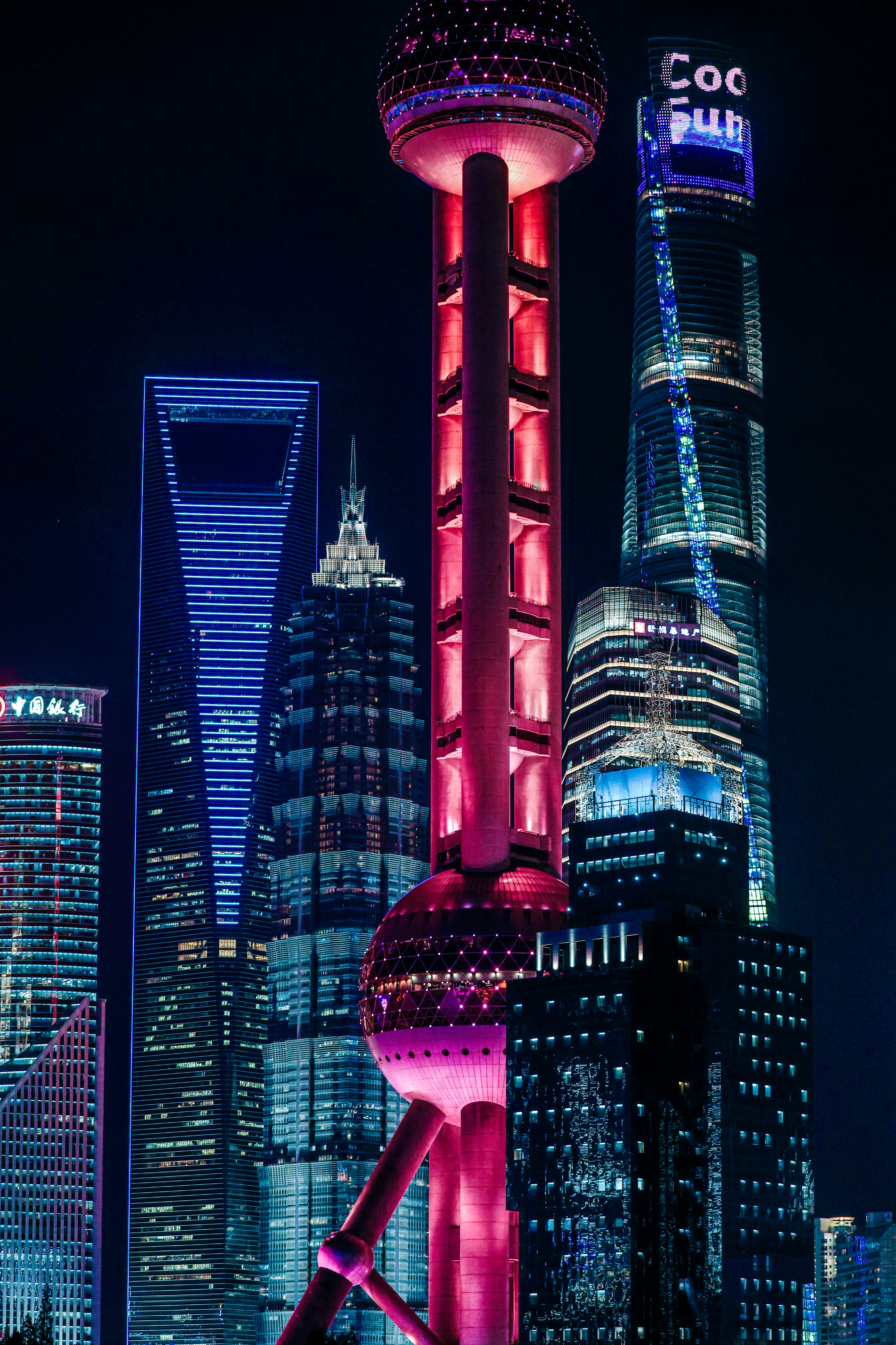 Shanghai skyline at night with the Oriental Pearl Tower illuminated