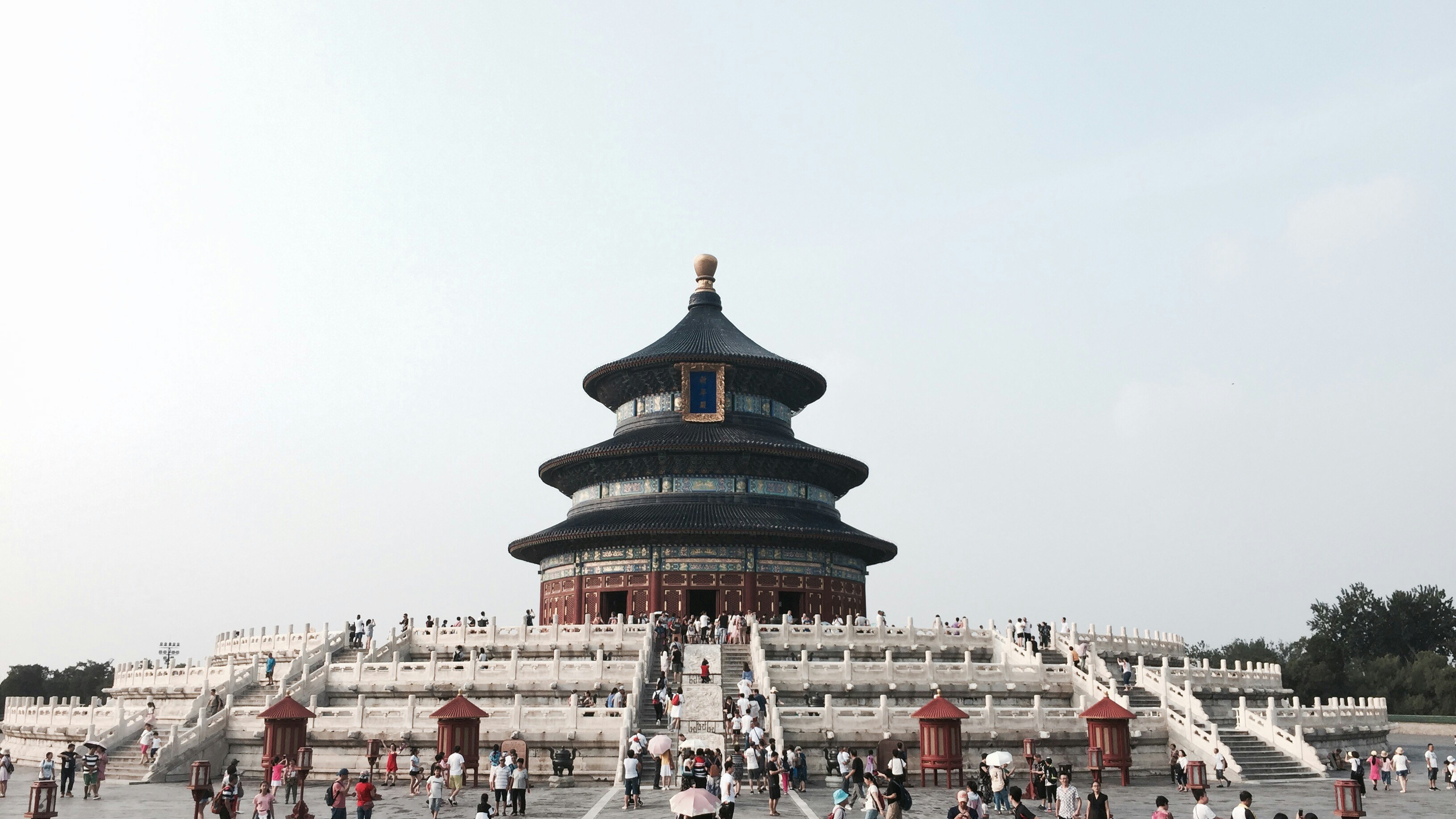 Temple of Heaven roofline against a pale Beijing sky